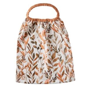 Serviette élastiquée en popeline imprimée feuillages / cassonade. Vendu par Rêves de Fil.